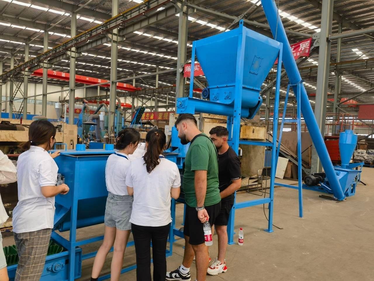 Fish feed pellet machine in operation producing tilapia feed