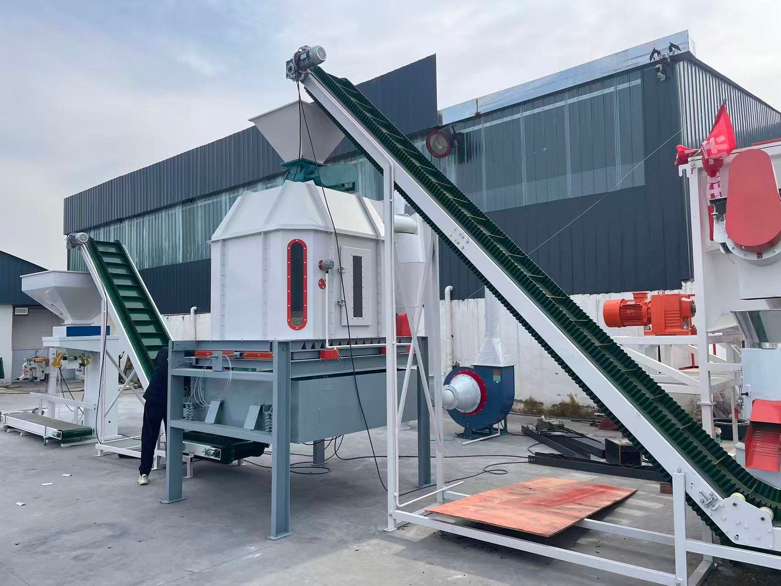 Small-scale chicken feed production line in farm setting